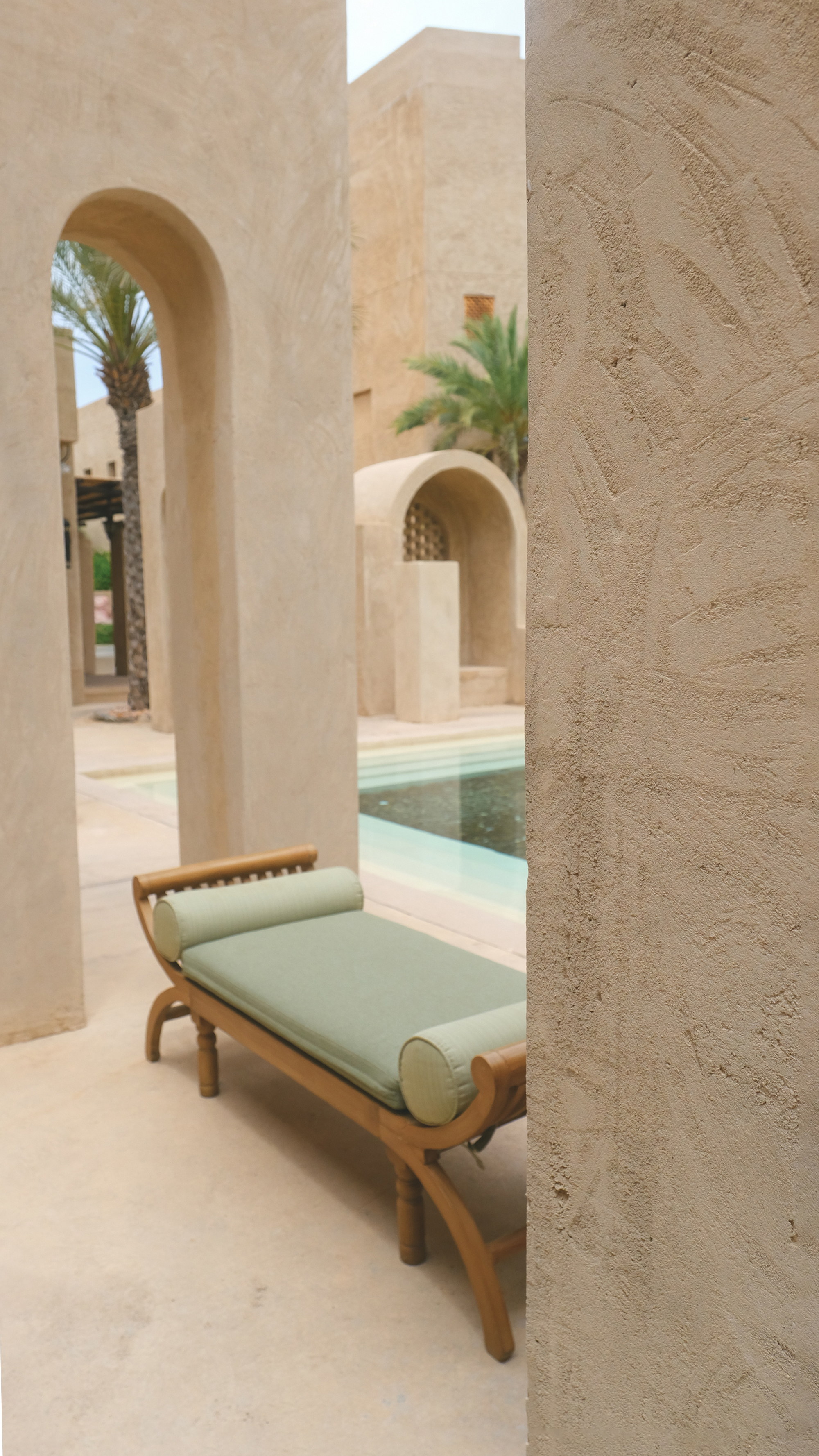 The bench between the arches, the pool beyond
