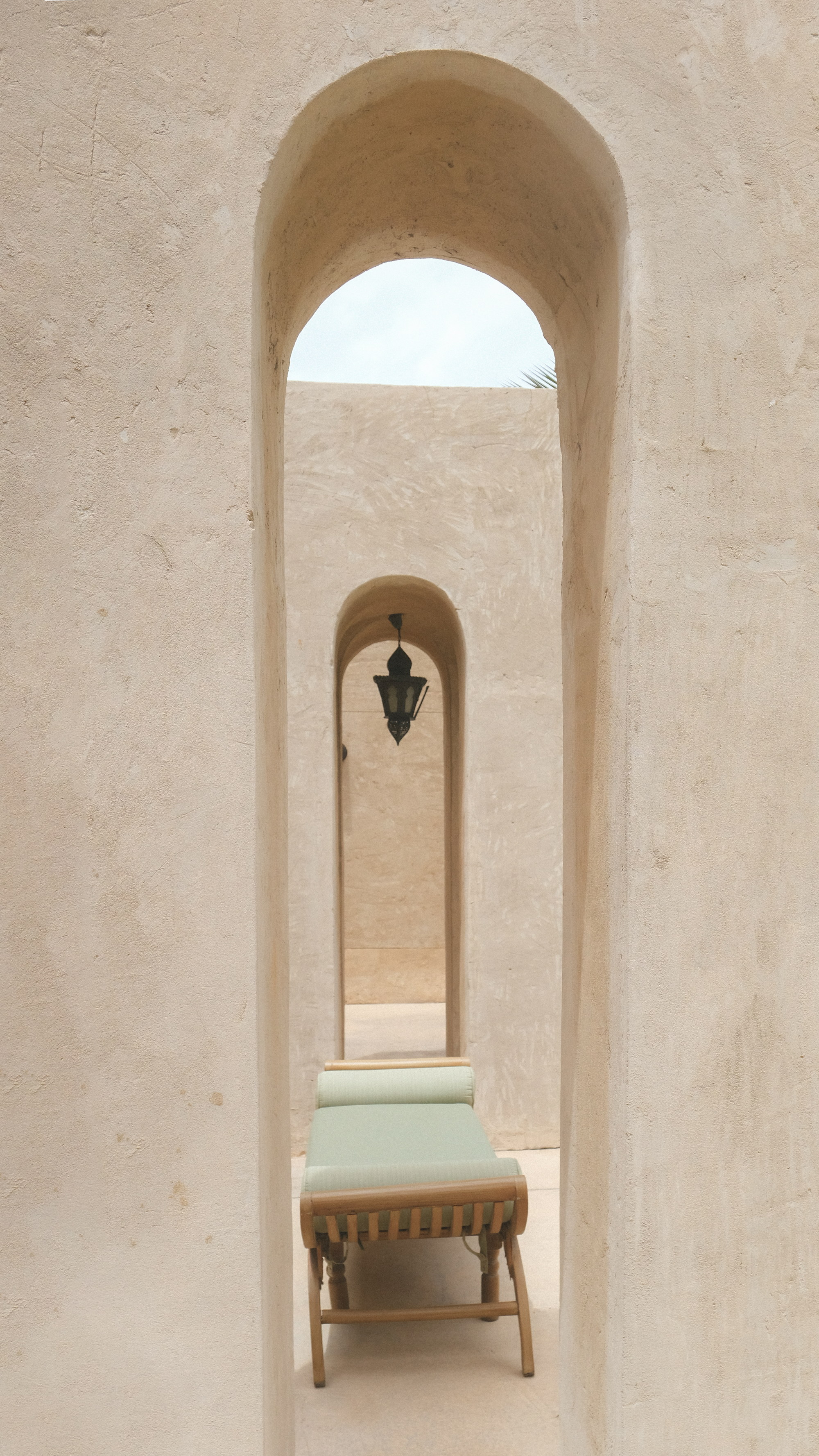 The daybed seen through the narrow arch