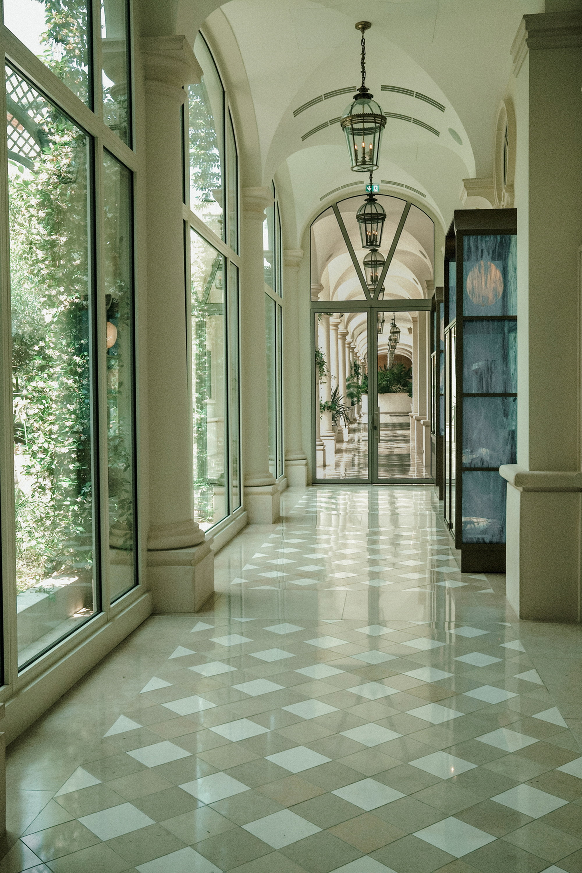 Inside the gallery, the jasmine pressing at the glass