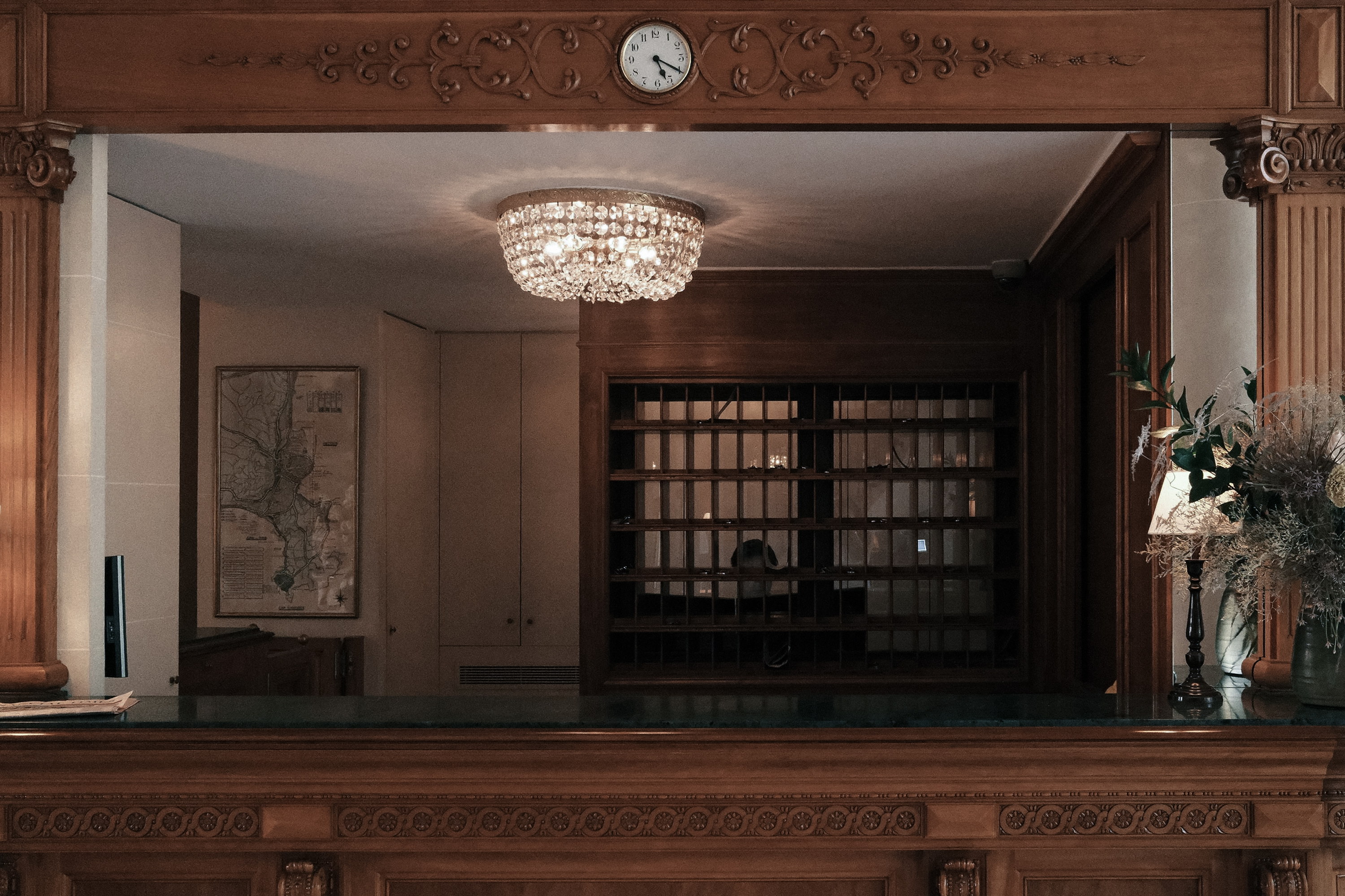 The reception desk beneath the clock