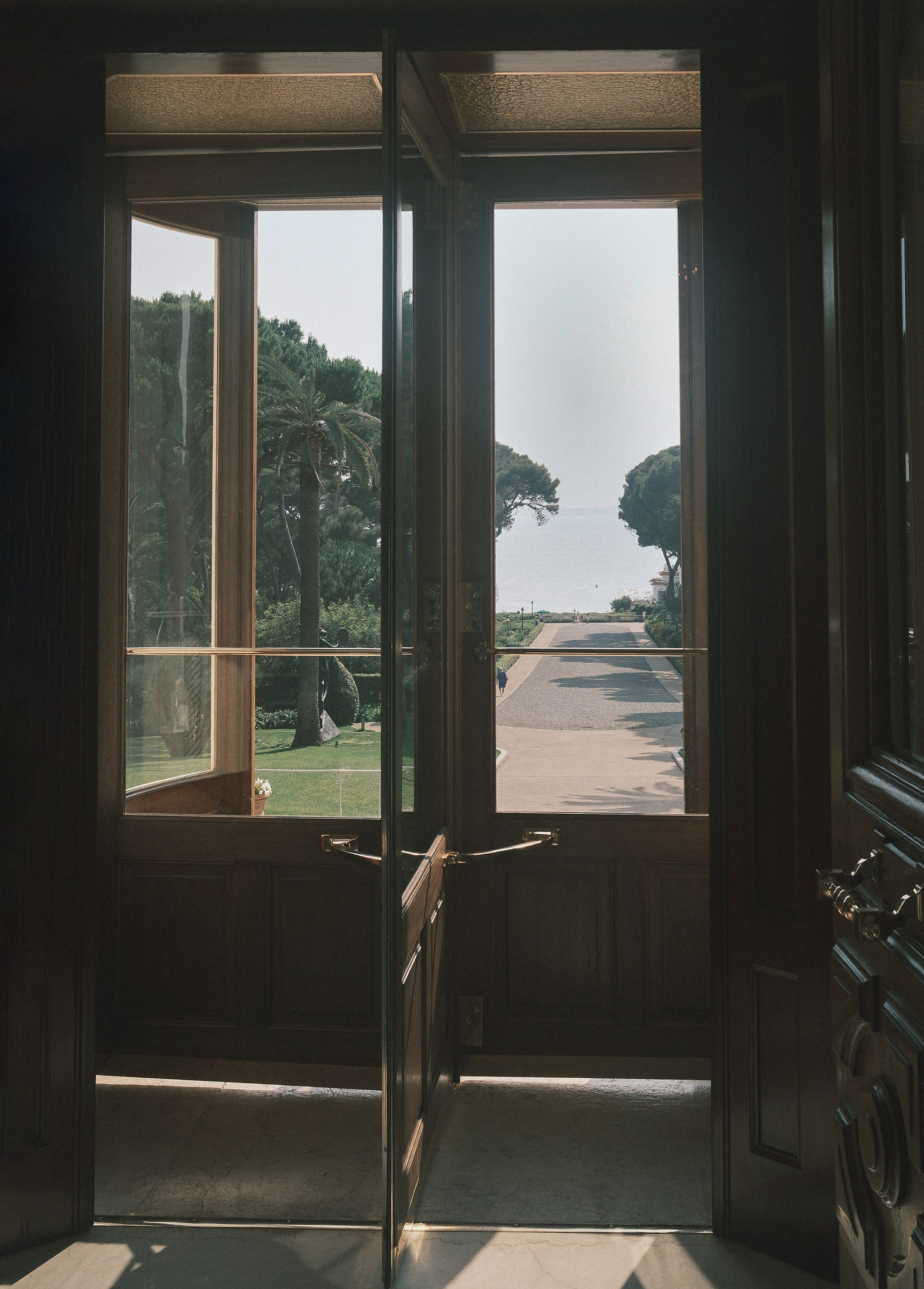 Doors standing open, light across the sill