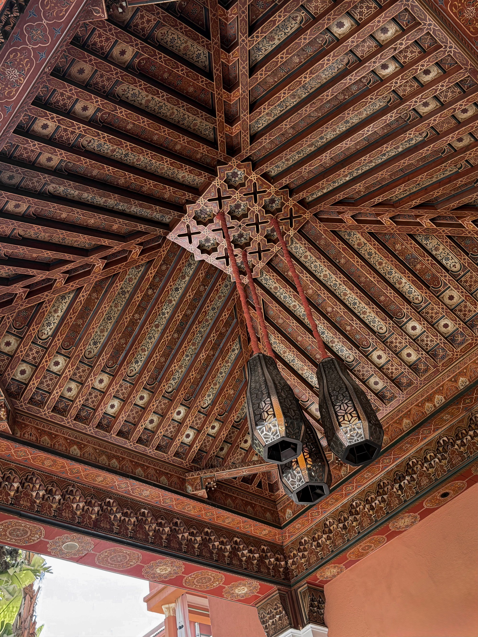 Worked ceiling, ornament held in raking light