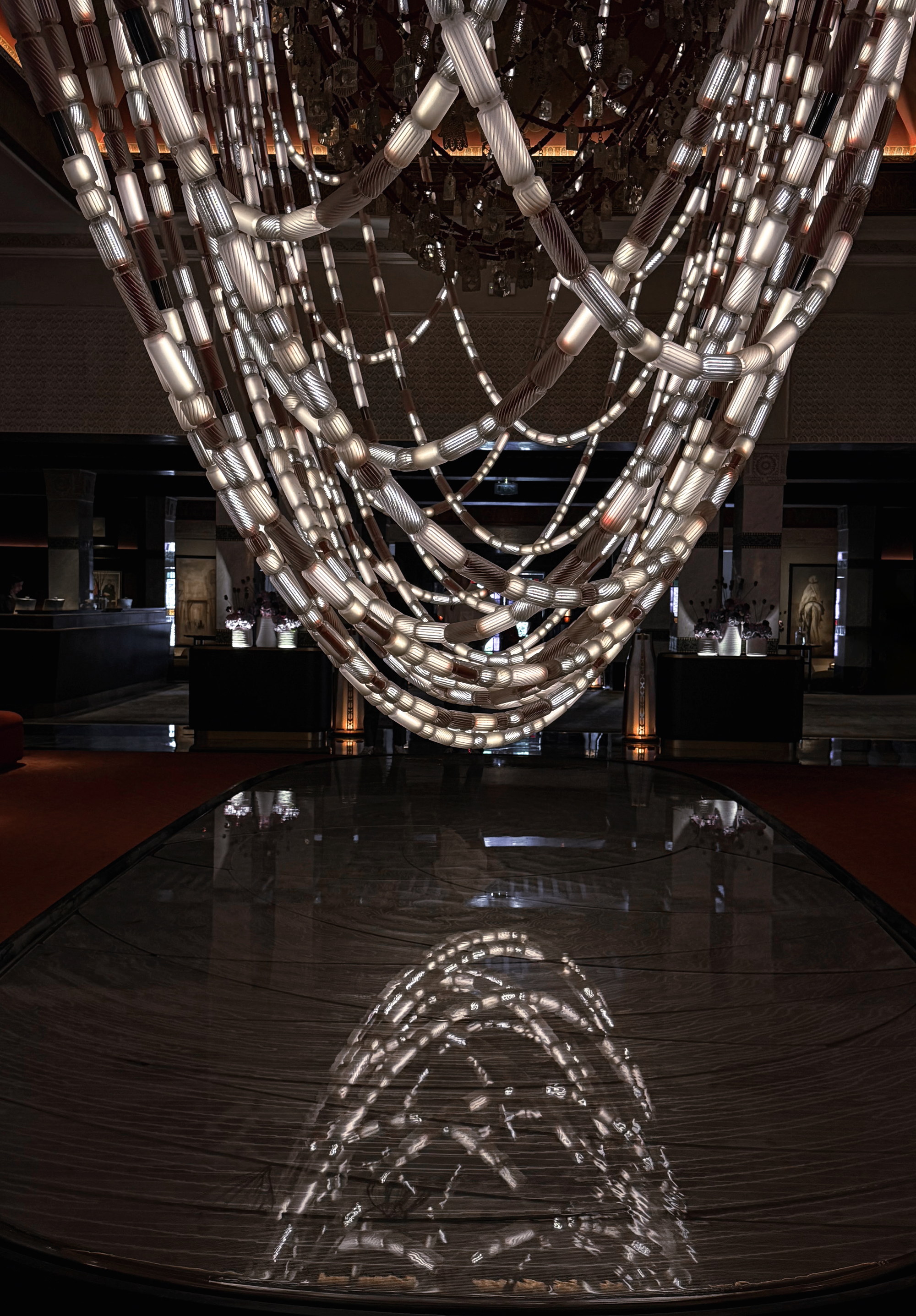 The lobby chandelier reflected