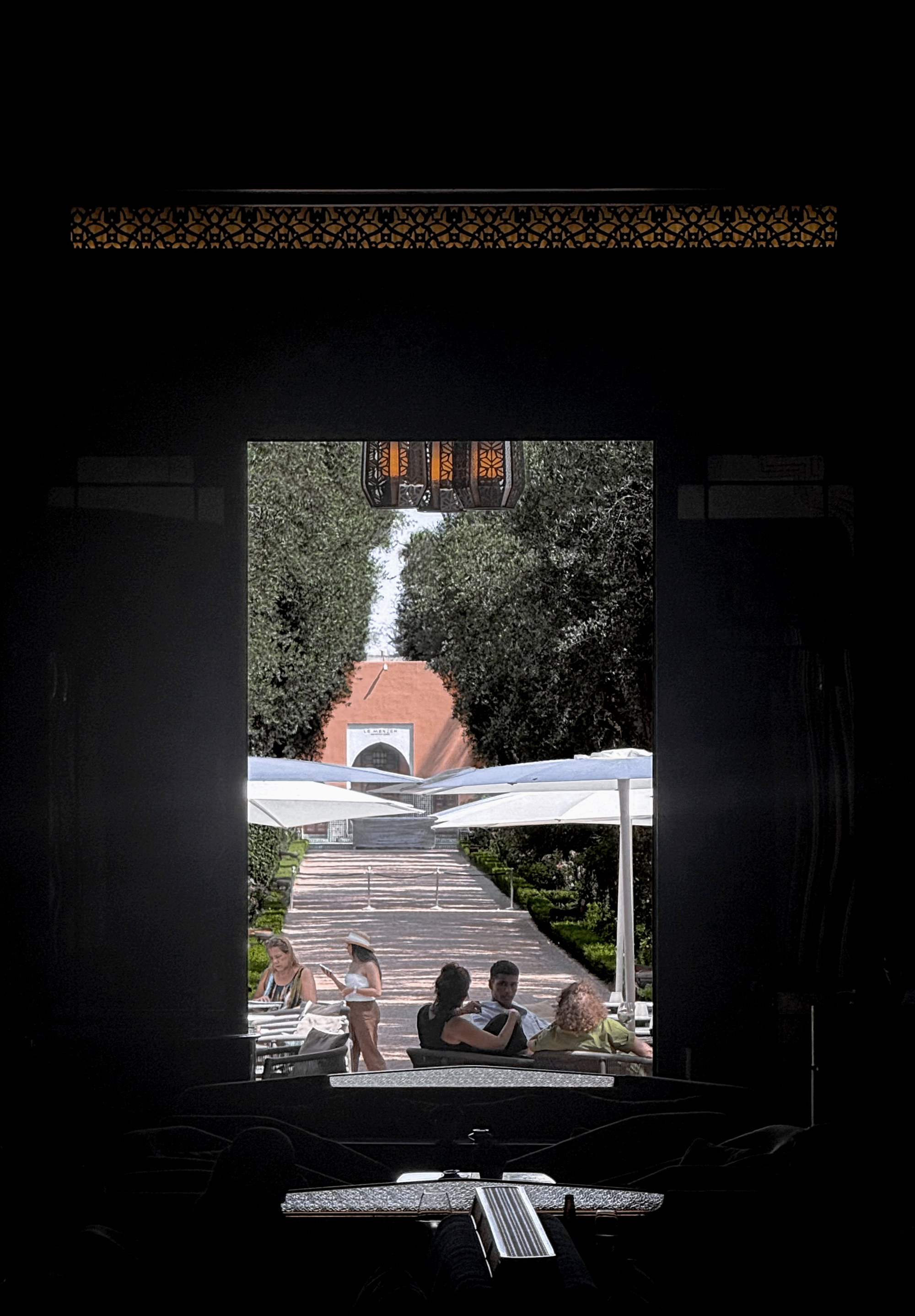 The garden seen from the shuttered interior